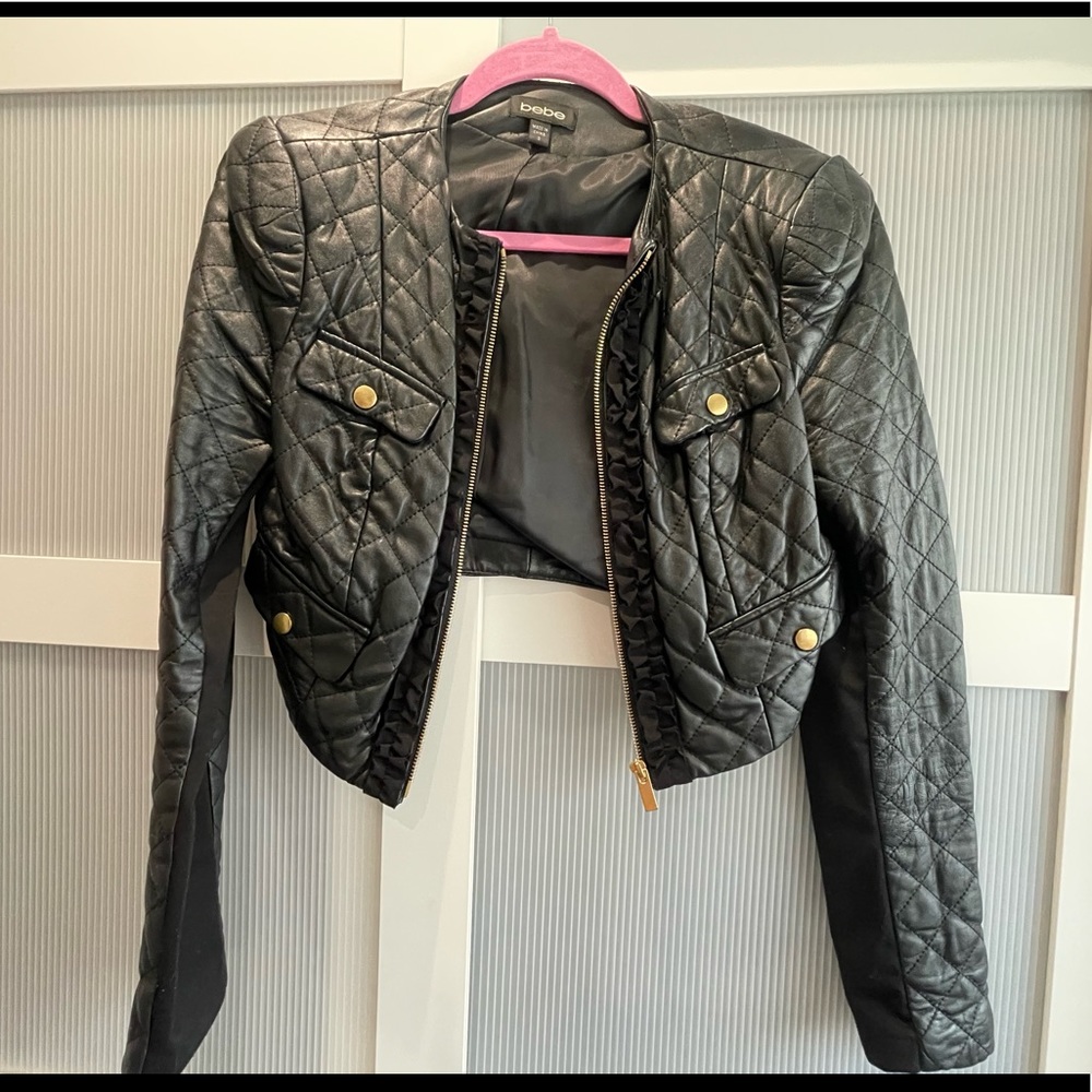 Bebe cropped leather jacket. Gold buttons and ruffle detail. Size S. Gently worn